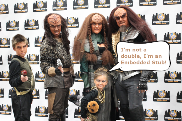 Photo of a family of Klingon cosplayers with the smallest one claiming she isn't a Double, she's an Embedded Stub